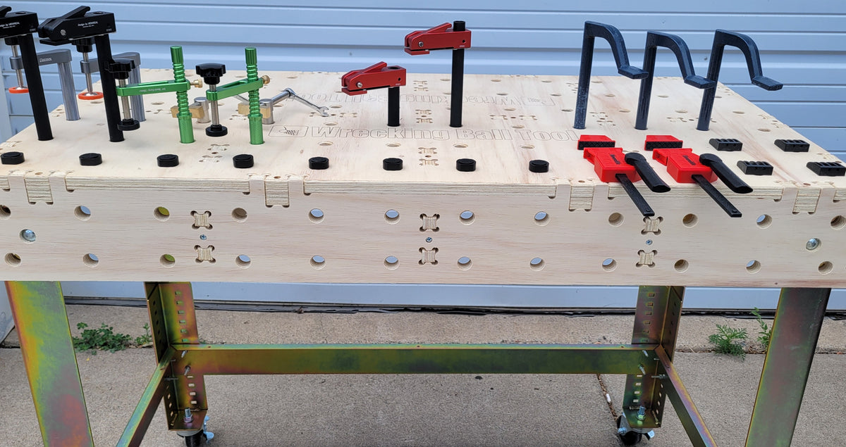 UltraBench UB2448 on UltraLeg UL2448 legs in use with bench dogs, toggle clamps and hold-downs